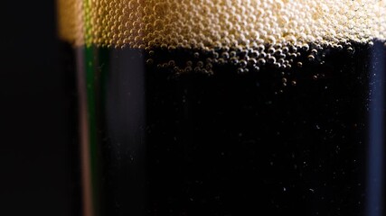 4K close-up of dark soda with fizzy bubbles in a glass - Powered by Adobe