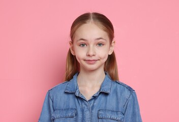 Fototapeta premium Portrait of cute girl on pink background