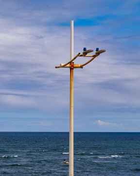 rusty pole on at the beach side