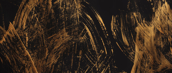 Obraz premium Gold glitter smear brush stroke blot painting paper. Abstract bronze, black color stain scratch grain texture background.