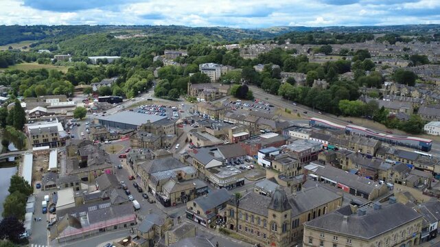 aerial drone view of the Brighouse town centre with buildings surrounded by west yorkshire countryside