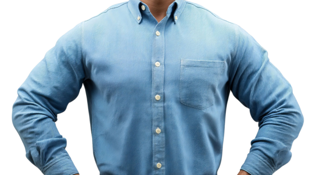 PNG of Confident male in a blue button-up shirt, standing with hands on hips, exuding strength and determination.