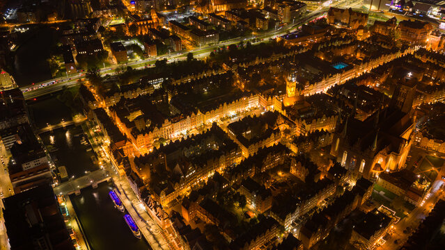 Aerial night view of Gdansk Old Town along the Motlawa River