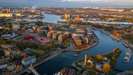 Naklejka premium Aerial late afternoon view of Gdansk with Motlawa River and shipyards