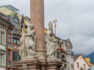 St. Anne’s Column with historic saints and ornate marble statues, city square in Innsbruck Austria