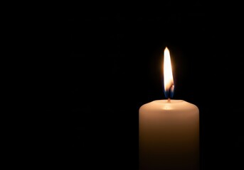 A brilliant single flame illuminates a pure white wax candle against a dark void, symbolizing hope, spirituality, and peace ,celebration ,black ,power