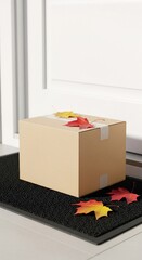 Package delivery at a front door during autumn. Cardboard box parcel on a doormat with colorful fall maple leaves. E-commerce online shopping and contactless delivery service concept.