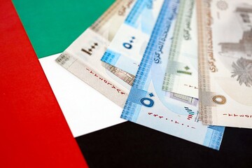 United Arab Emirates dirham currency money bills lies on flag close up. The concept of business and investment
