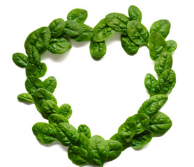 heart of green leaves spinach on a white background