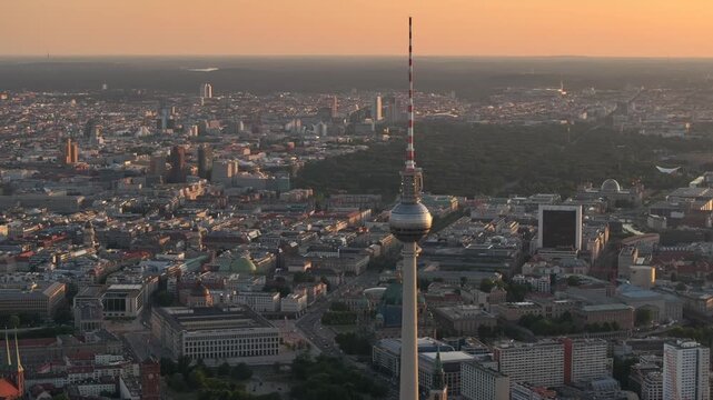 Alexanderplatz TV Tower Close Up View, Fernsehturm at Sunset Time in Berlin City Center, Aerial Parallax Drone Shot.