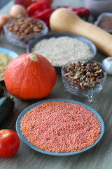 Assortment of various healthy fruits, vegetables, grains and legumes. Selective focus, wooden background.