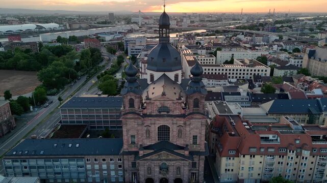 Aerial drone footage of Mannheim and Christuskirche on summer evening, showcasing German architecture. Mannheim, Germany