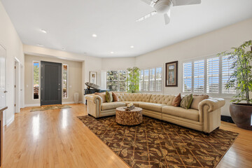 A cozy living room with a comfy couch and wallmounted TV