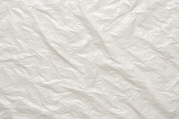 Fototapeta premium Crinkled white plastic film wrap texture high detail shiny surface seamless background