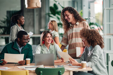 Diverse business team collaborating in shared office space