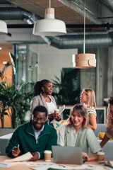 Diverse business professionals collaborating in modern office space