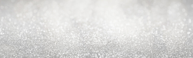 Christmas background with white glitters and bokeh lights. Banner design