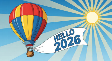 Obraz premium Bright hot air balloon soars into sunny sky, carrying a banner with 'HELLO 2026' for a new year celebration.