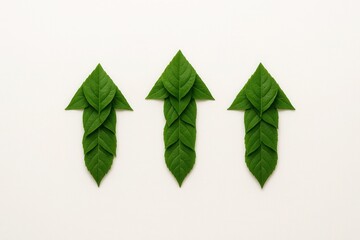 Recycling arrows shaped from fresh leaves on white minimal eco banner with copy space