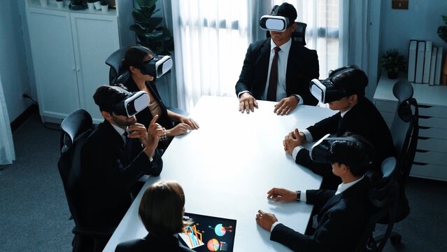 Top view of project manager working on laptop and sending data analysis to business people by using VR glass headset. Professional marketing team enter metadata or virtual world program. Directorate.