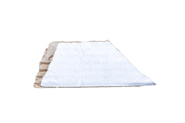 Close-up of a piece of cardboard with white paper, showcasing texture and material details. Ideal for design or craft projects, illustrating eco-friendliness.