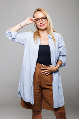 Businesswoman posing confidently in casual attire, showcasing a blend of professionalism and...