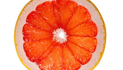 A cross-section of a ripe, juicy grapefruit, with vibrant red pulp and white pith, against a dark background
