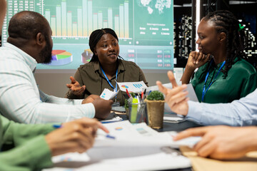 Chairman of the board examining potential company expansion plans, team supervisor and the staff...