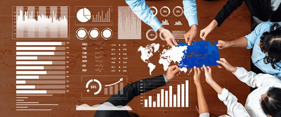 A dynamic scene showcasing a collaborative business meeting with diverse hands analyzing data visualizations, charts, and maps on a wooden table. Axiom
