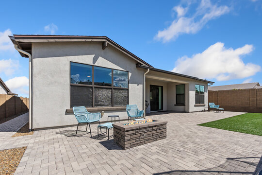 outdoor patio featuring seating and firepit, backyard lounge zone with fire feature and privacy