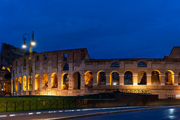 2019-11-01 A EARLY MORNING LOOK AT THE COLOSSEUM IN ROME ITALY WITH LIGHTS PROVIDING A WARM GLOW