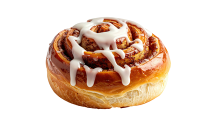 Sweet cinnamon roll topped with white icing glaze, isolated against a black background, appears fresh and tasty