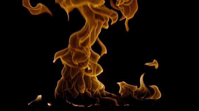 4K Rising flames in slow motion on black background, detailed orange and yellow fire motion ideal for screen mode or overlay, cinematic high-quality VFX element for film compositing, video editing,
