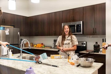 Experience the Joyful Cooking Moment within a Modern Kitchen Space