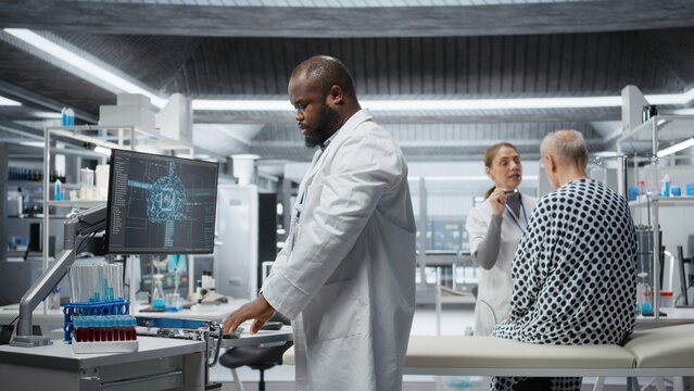 Black medic recording pharmacology data with artificial intelligence, analyzing patient reaction for a new drug testing with machine learning and neural networks. Medical progress. Camera A.