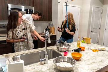 Fun Cooking Moments in a Modern Kitchen with Friends