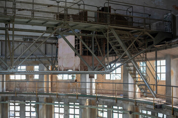 Abandoned distillery tower in Italy – circular industrial building with glass dome, steel beams, panoramic windows, decaying factory interior, urban exploration, post-industrial architecture