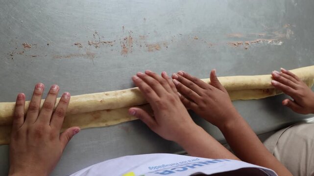 Close Up of Baker Hands Kneading Dough for Homemade Artisan Bread