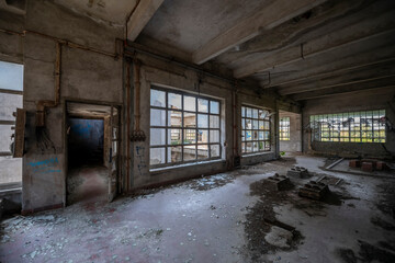 Abandoned distillery tower in Italy – circular industrial building with glass dome, steel beams, panoramic windows, decaying factory interior, urban exploration, post-industrial architecture