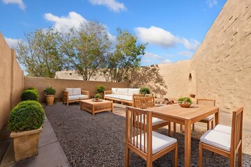 There is a lovely patio featuring a table, chairs, and a couch