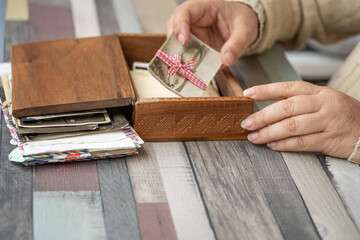 set Vintage empty photographs in female hand, Tracing family roots through images, journey into ancestry, family history and heritage, nostalgia antique artwork, family ties, memories childhood