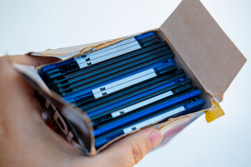 Colorful pile vintage 3.5 inch floppy disks on wooden surface, retro computing, obsolete data storage, tech nostalgia, digital history, collection old media formats 80s, 90s, nostalgic tech memory