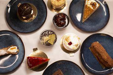 An assortment of delectable desserts beautifully arranged on plates for an impressive presentation and display