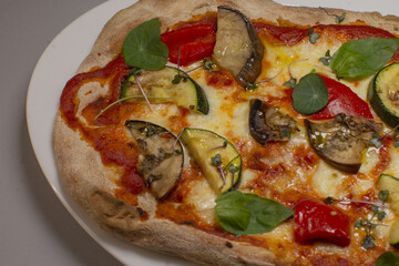 Woodfired vegetable pizza with herbs, Colorful roasted vegetable pizza with melted cheese, Artisan roasted vegetable pizza featuring fresh herbs and vibrant