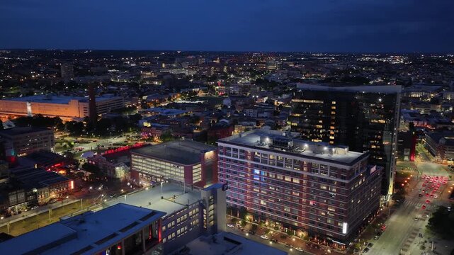 Aerial footage of skyscrapers and office buildings in the skyline at sunset in Baltimore Maryland USA