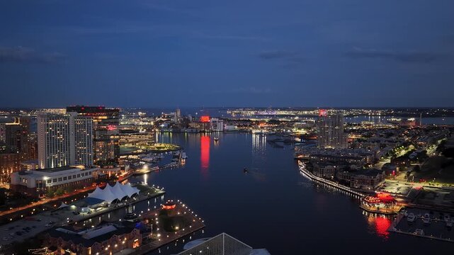 Aerial footage of skyscrapers and office buildings in the skyline along the Patapsco River in Baltimore Maryland USA