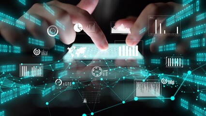A futuristic digital interface showcases various data visualizations and analytical charts on a touchscreen, highlighting human-computer interaction in modern technology. Xenic