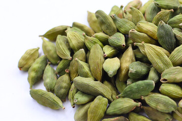 Green cardamom pods with aromatic and medicinal benefits.