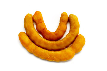 Sweet preserved tamarinds on white background.