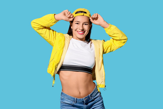 Fototapeta Female hip-hop dancer on blue background